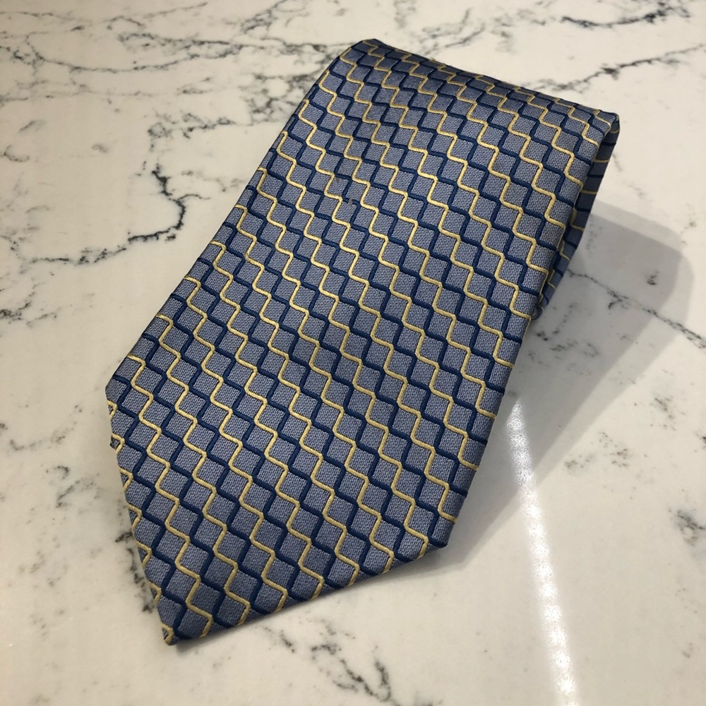 Blue and yellow patterned tie. By Tom James.